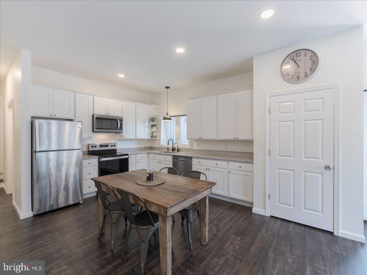 102 Upper Valley Road Christiana, PA 17509 - Photo 47 of 75 a kitchen with white cabinets and stainless steel appliances