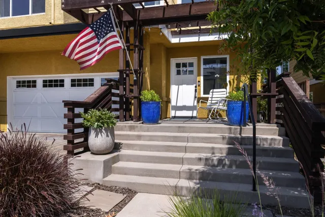 a front view of house with outdoor seating