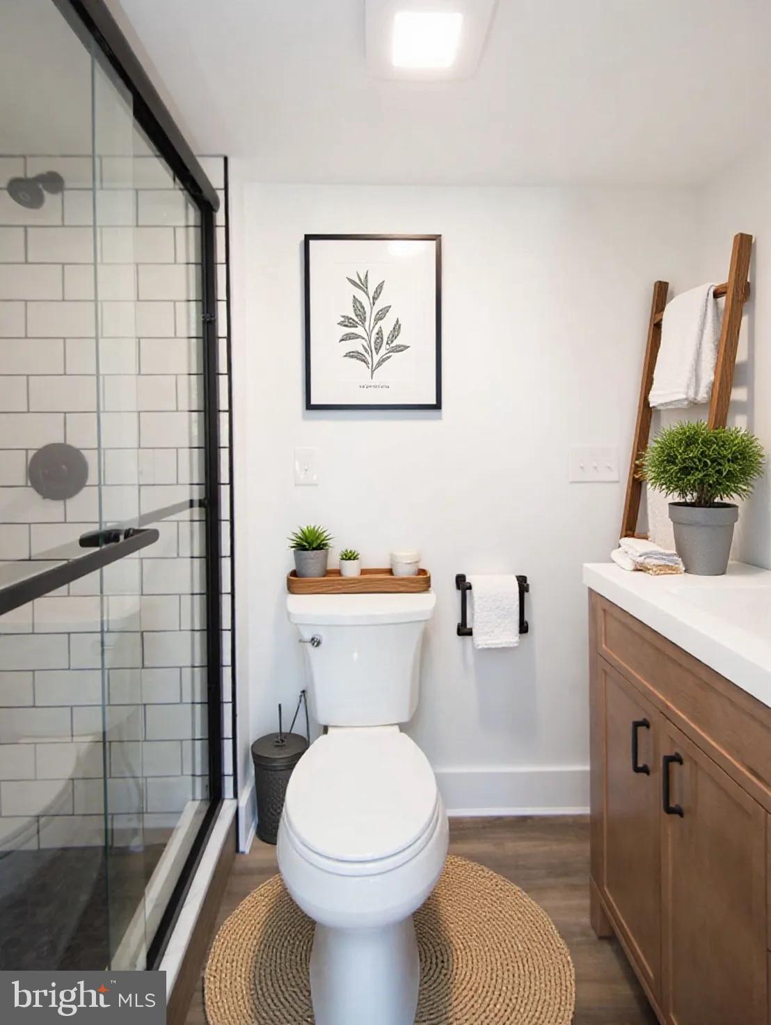 11453 Riverton Road Mardela Springs, MD 21837 - Photo 29 of 71 a bathroom with a toilet a sink and shower