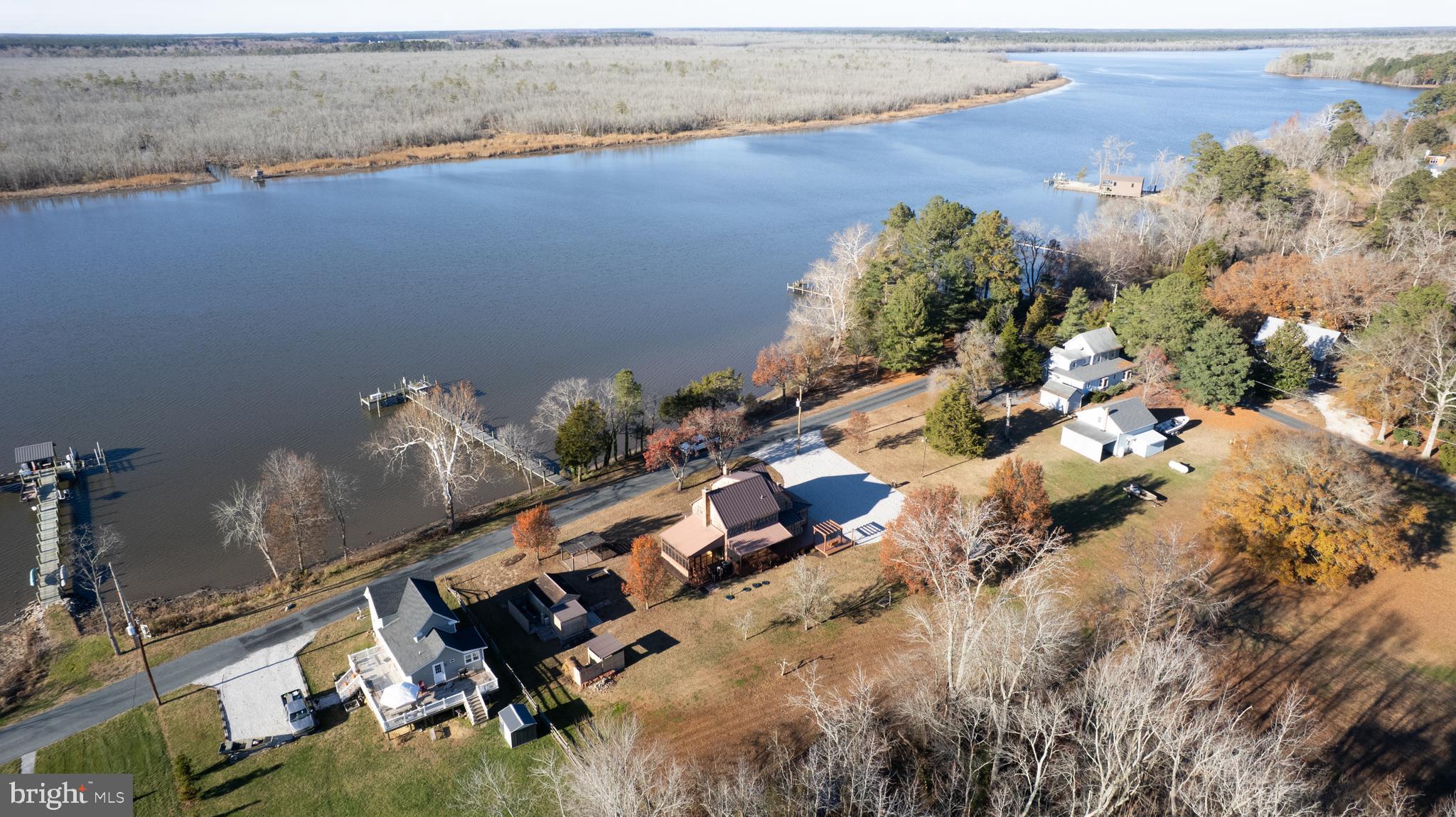 11453 Riverton Road Mardela Springs, MD 21837 - Photo 4 of 71 an aerial view of a house with a yard and lake view