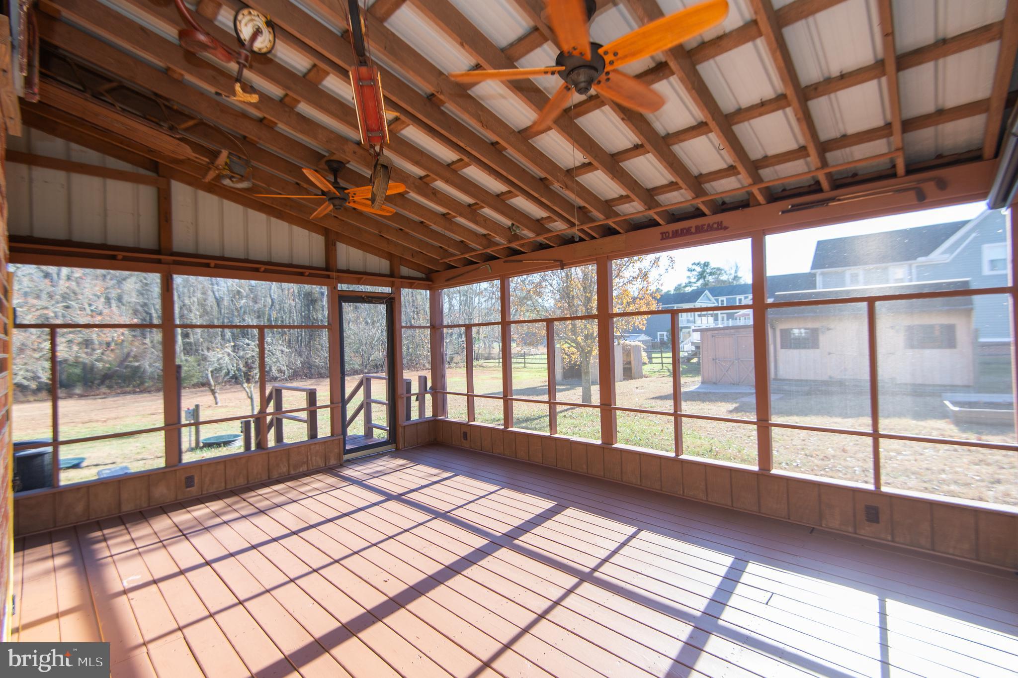 11453 Riverton Road Mardela Springs, MD 21837 - Photo 49 of 71 a view of an empty room with wooden floor and a window