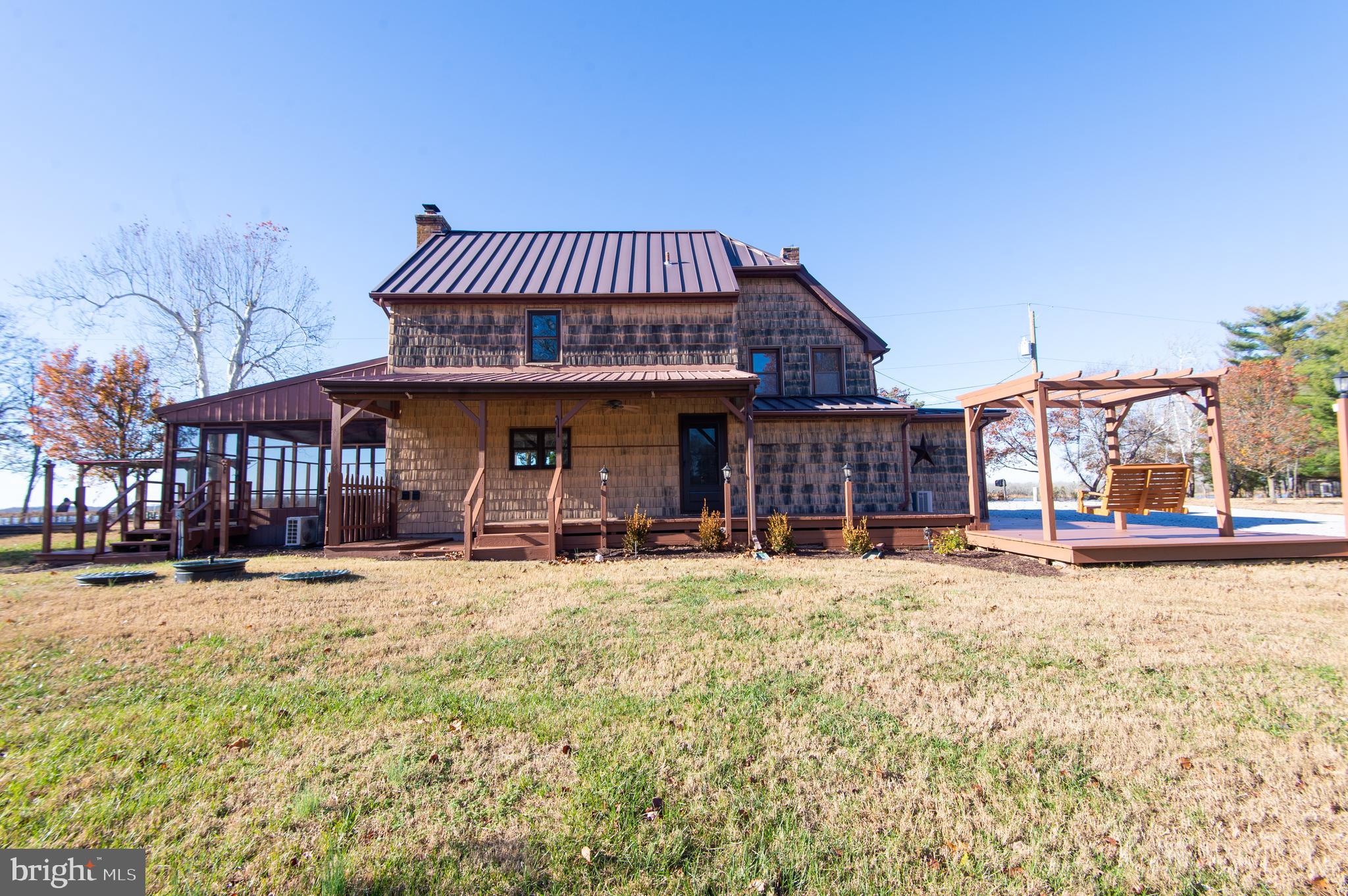 11453 Riverton Road Mardela Springs, MD 21837 - Photo 52 of 71 a view of a house with a yard and sitting area