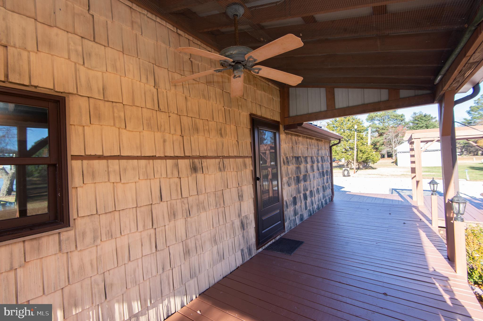 11453 Riverton Road Mardela Springs, MD 21837 - Photo 54 of 71 a view of a porch with wooden floor and outdoor space