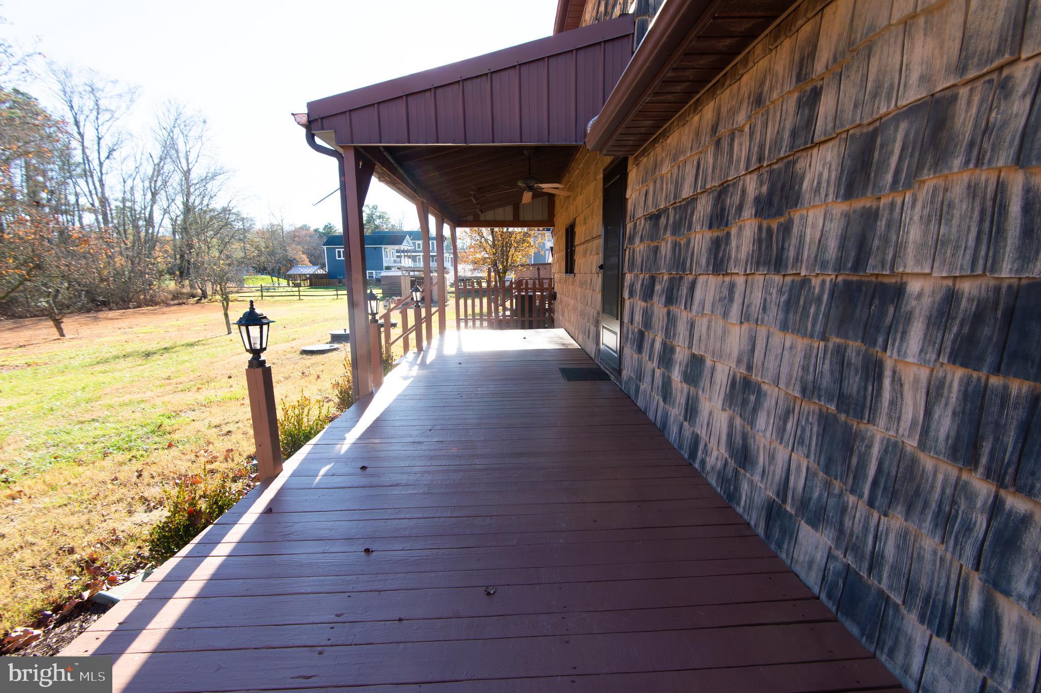 11453 Riverton Road Mardela Springs, MD 21837 - Photo 55 of 71 a view of a balcony with wooden floor