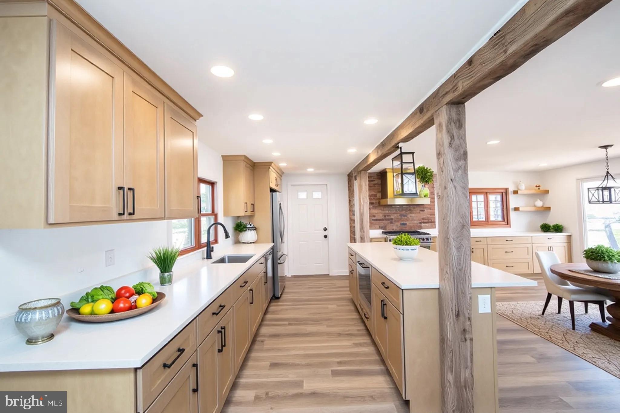 11453 Riverton Road Mardela Springs, MD 21837 - Photo 9 of 71 a large white kitchen with lots of clutter and stainless steel appliances