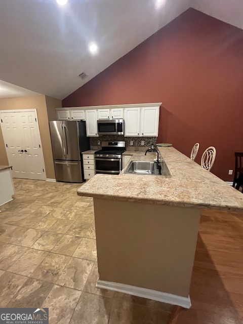 275 Rehobeth Way Fayetteville, GA 30214 - Photo 8 of 25 a kitchen with stainless steel appliances a refrigerator a sink a stove top oven and a counter top space
