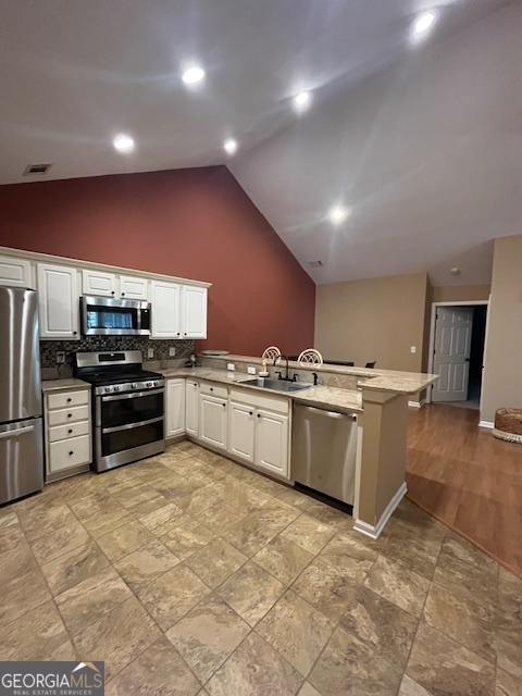 275 Rehobeth Way Fayetteville, GA 30214 - Photo 9 of 25 a kitchen with a sink and stainless steel appliances