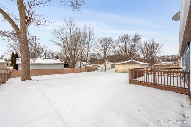 a view of outdoor space with deck and a yard
