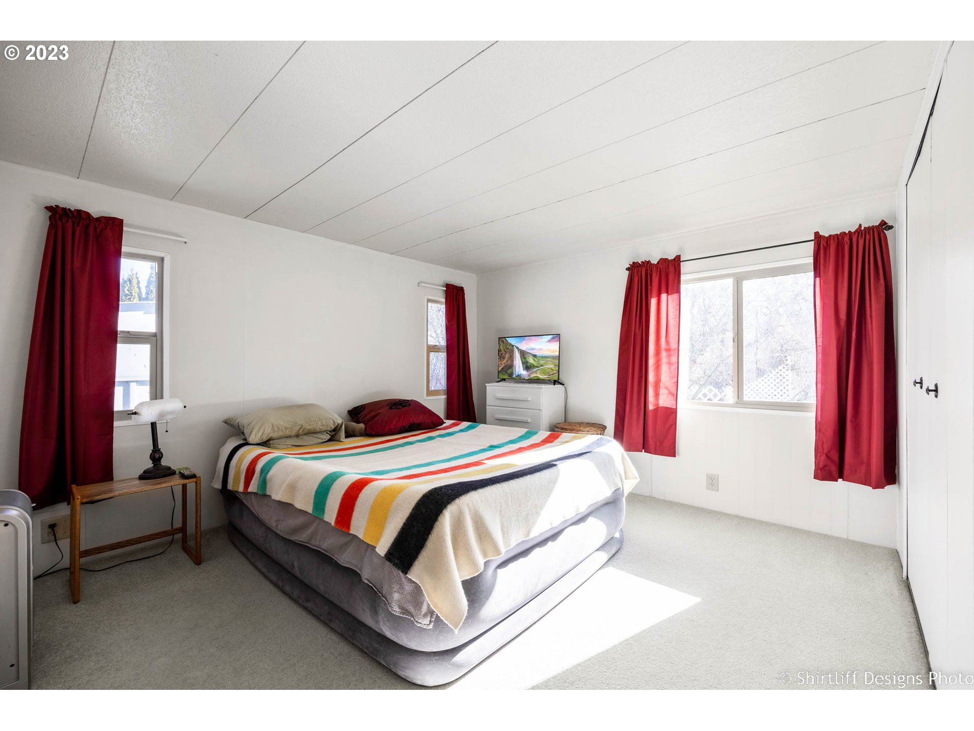 1475 Green Acres Road, Unit 123 Eugene, OR 97408 - Photo 17 of 23 a bedroom with a bed and window