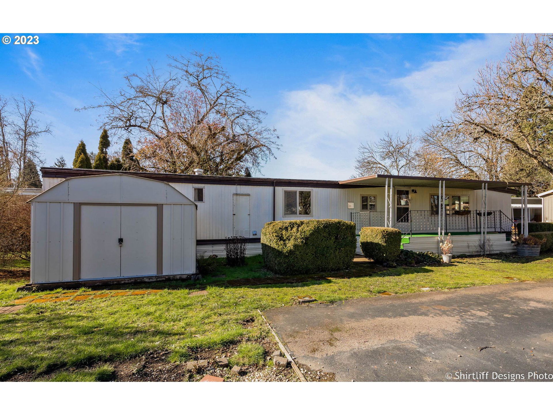 1475 Green Acres Road, Unit 123 Eugene, OR 97408 - Photo 22 of 23 a view of a house with backyard and sitting area
