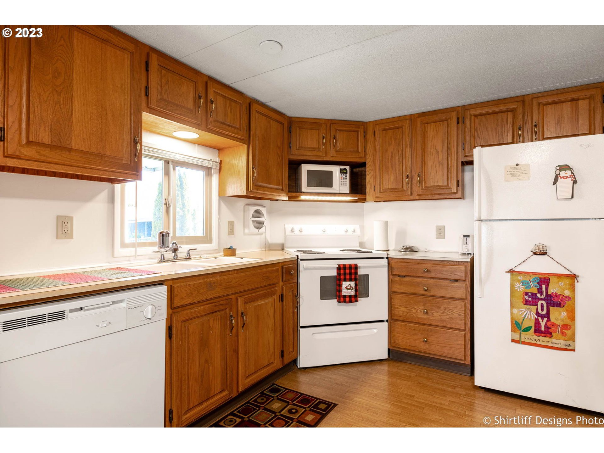 1475 Green Acres Road, Unit 123 Eugene, OR 97408 - Photo 6 of 23 a kitchen with stainless steel appliances granite countertop a stove and a sink