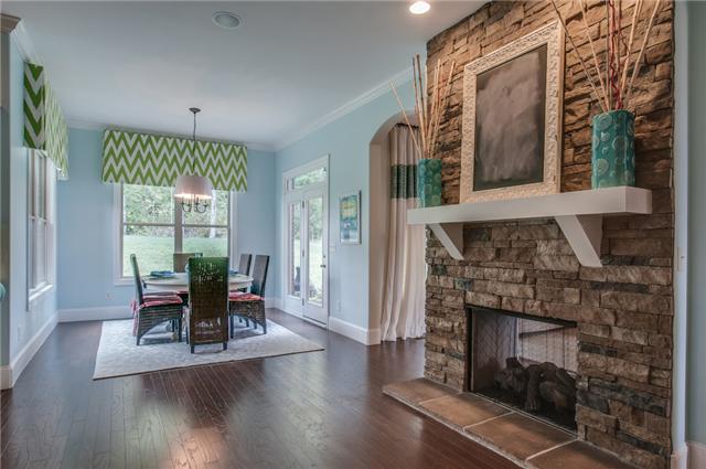 175 Azalea Lane Franklin, TN 37064 - Photo 6 of 20 Kitchen Nook and keeping area. Double sided Stacked Stone Fireplace