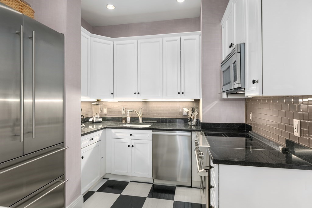 20 Tileston Street, Unit 2H Boston, MA 02113 - Photo 7 of 22 a kitchen with stainless steel appliances granite countertop a refrigerator and a sink
