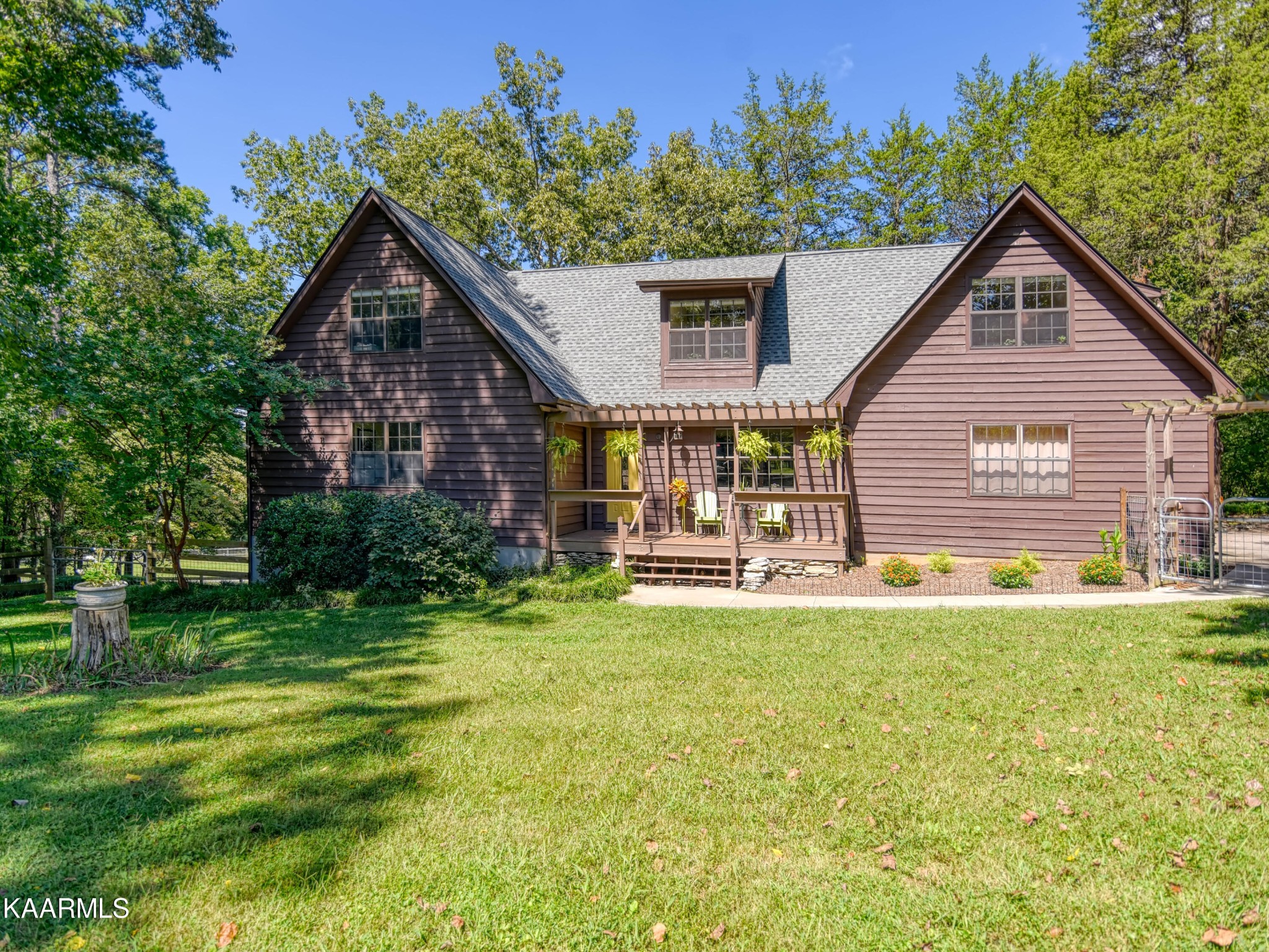 1203 Mountain Road Clinton, TN 37716 - Photo 1 of 59 a view of a house with pool and chairs