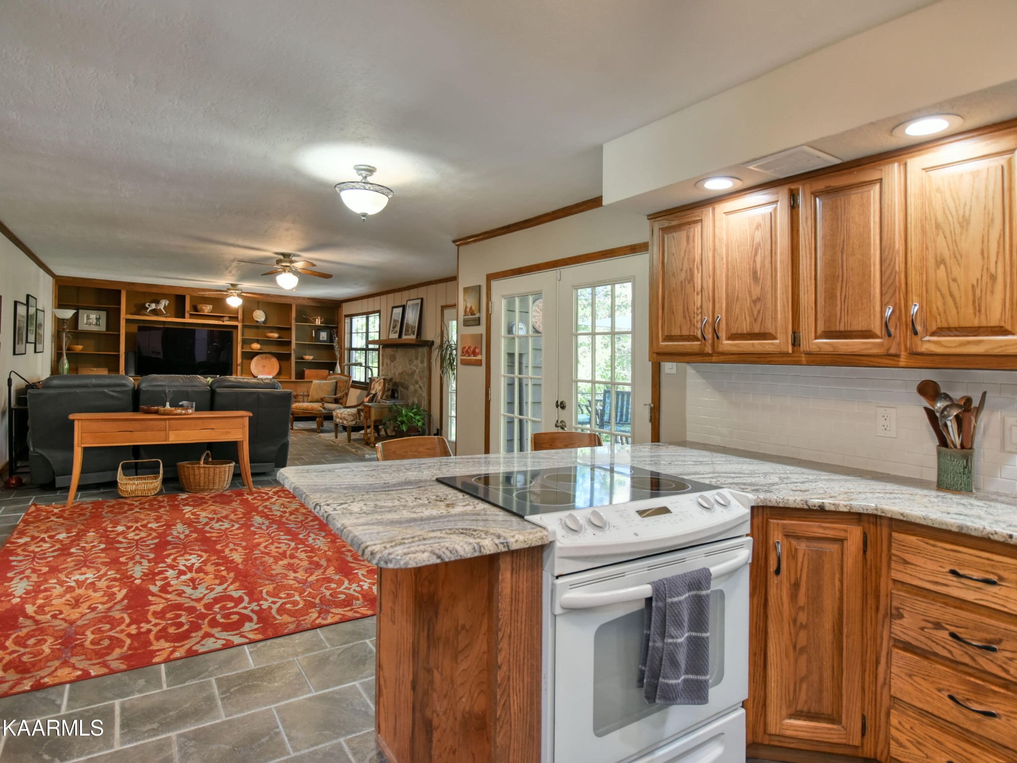 1203 Mountain Road Clinton, TN 37716 - Photo 19 of 59 a kitchen with stainless steel appliances granite countertop a sink and cabinets