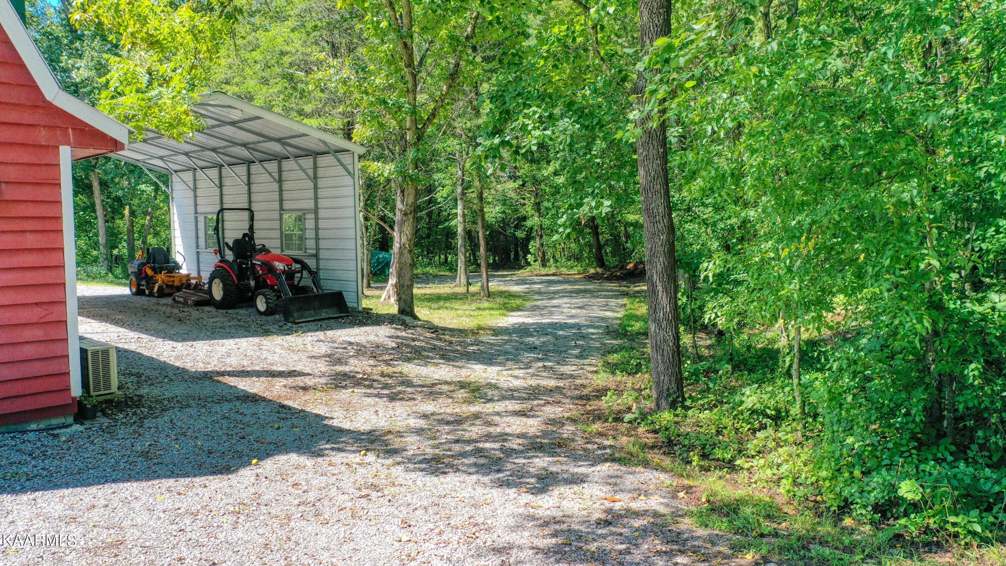 1203 Mountain Road Clinton, TN 37716 - Photo 10 of 59 a view of a park with large trees and a barn