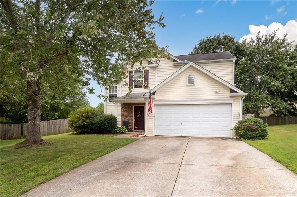 604 Red Oak Court Canton, GA 30114 - Photo 1 of 1 a view of white house with a yard and potted plants
