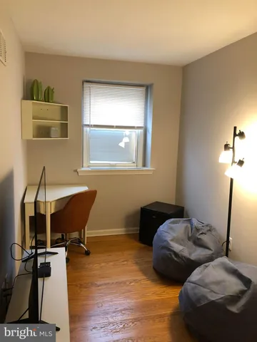 a bedroom with furniture and a window