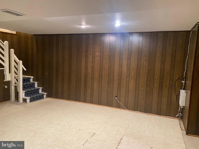 a view of an empty room with stairs
