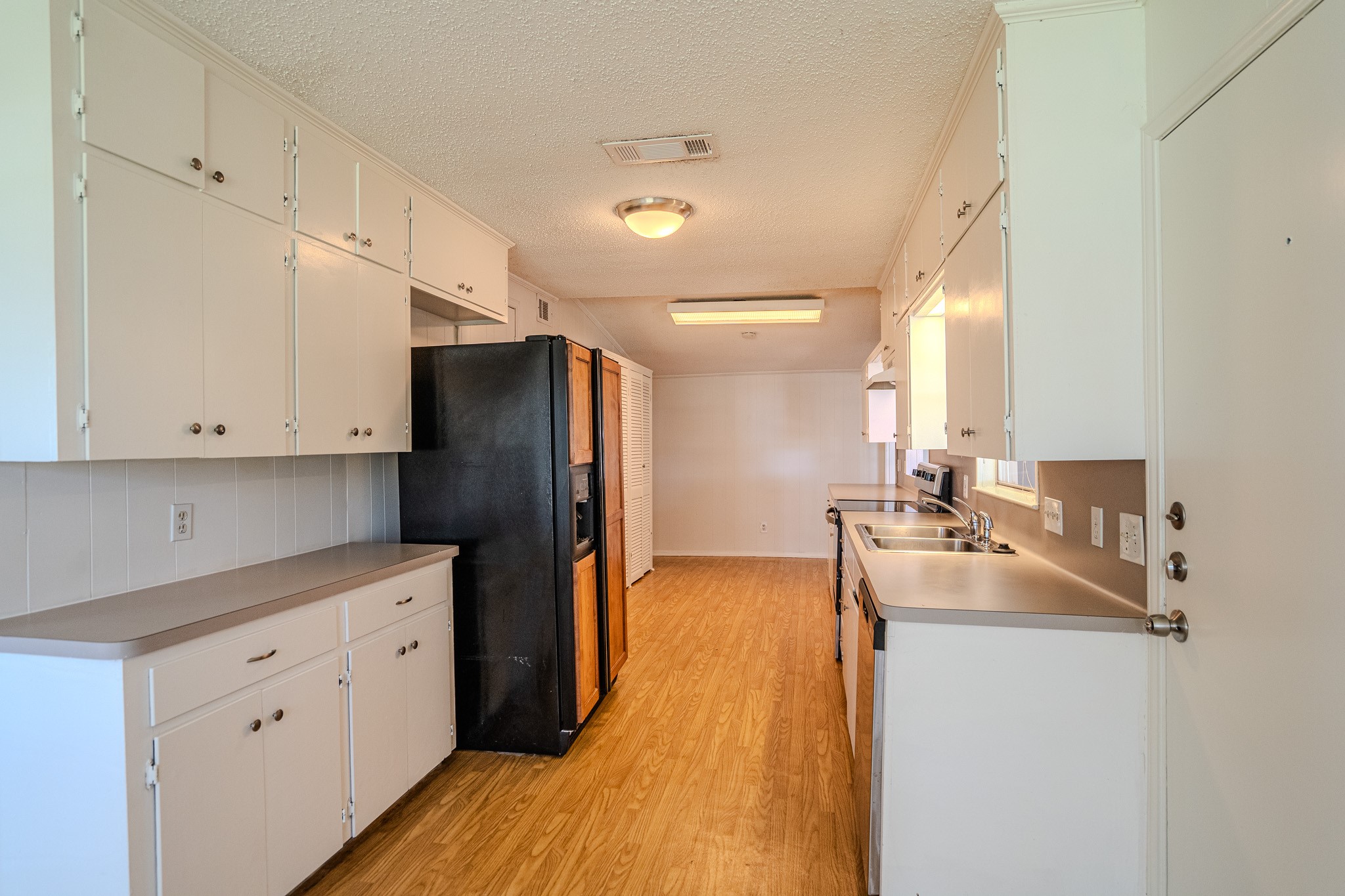16013 Edwards Drive Austin, TX 78734 - Photo 9 of 18 Functional kitchen with ample cabinetry and generous counter space.