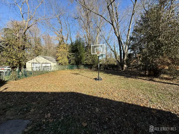 a view of a backyard of the house