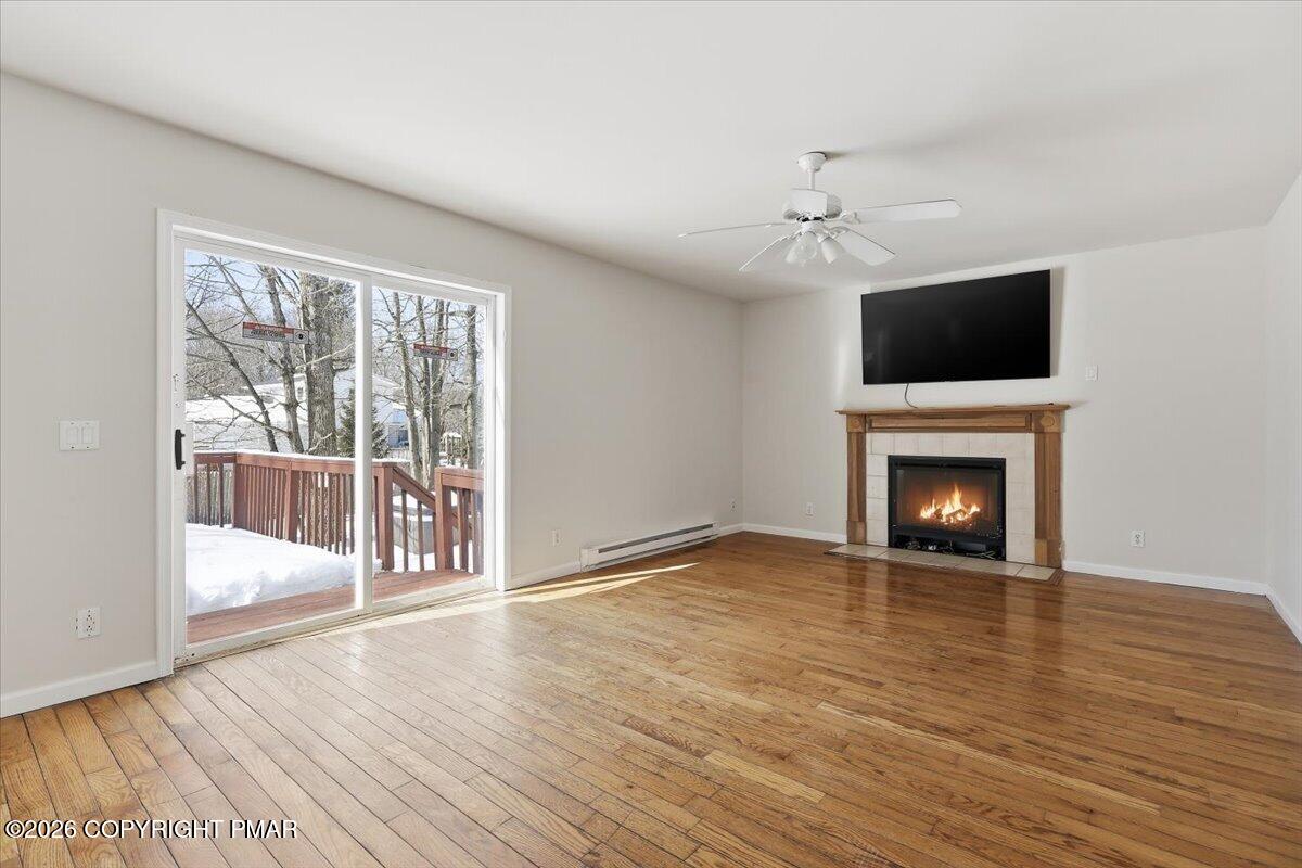 12 Devonshire Lane Mount Pocono, PA 18344 - Photo 15 of 39 a view of an empty room with a fireplace and a window