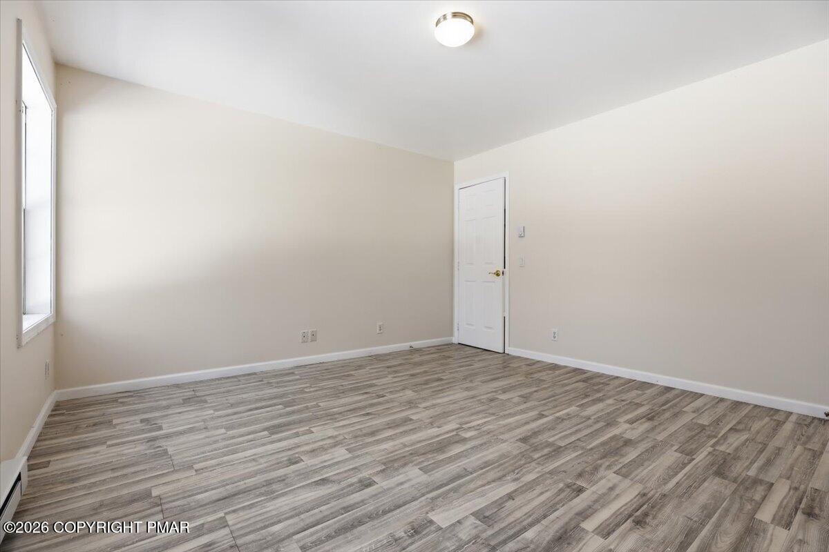 12 Devonshire Lane Mount Pocono, PA 18344 - Photo 20 of 39 a view of an empty room with wooden floor