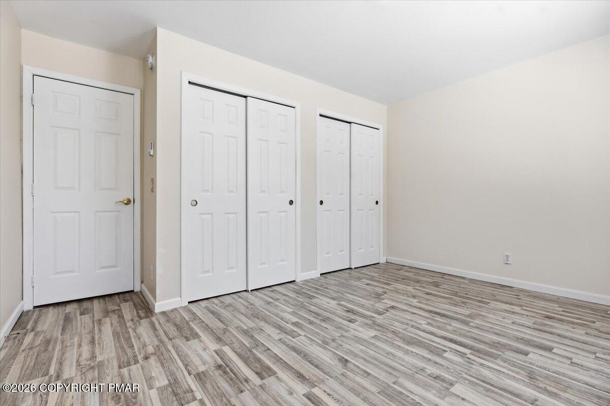 12 Devonshire Lane Mount Pocono, PA 18344 - Photo 22 of 39 a view of room with wooden floor