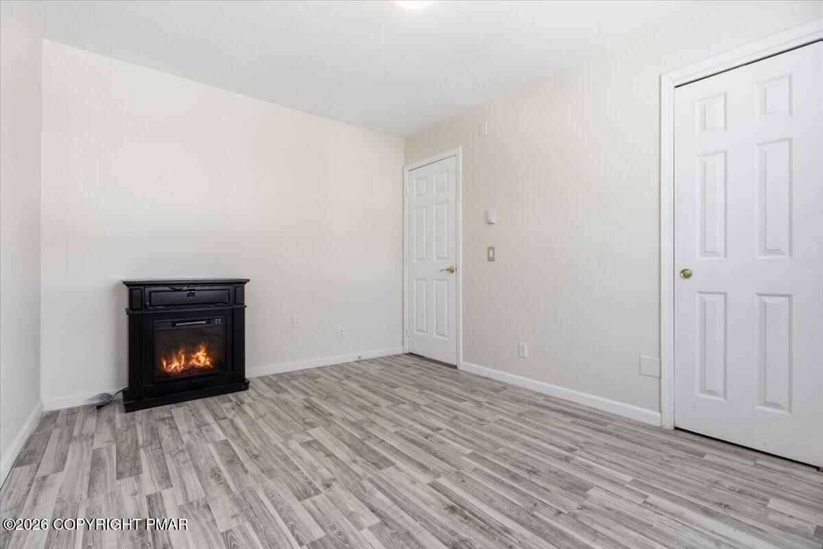12 Devonshire Lane Mount Pocono, PA 18344 - Photo 24 of 39 a view of an empty room and wooden floor