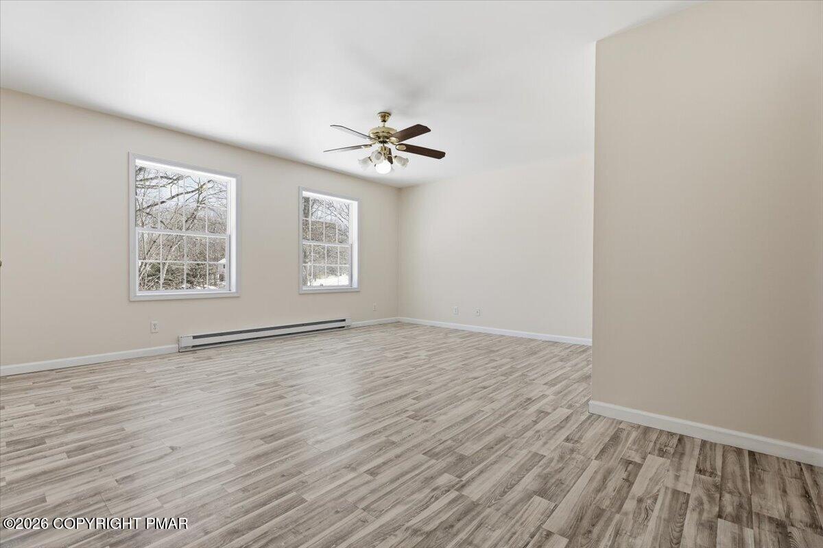 12 Devonshire Lane Mount Pocono, PA 18344 - Photo 28 of 39 wooden floor in an empty room with a window