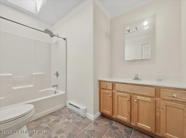 a bathroom with a toilet sink and bathtub