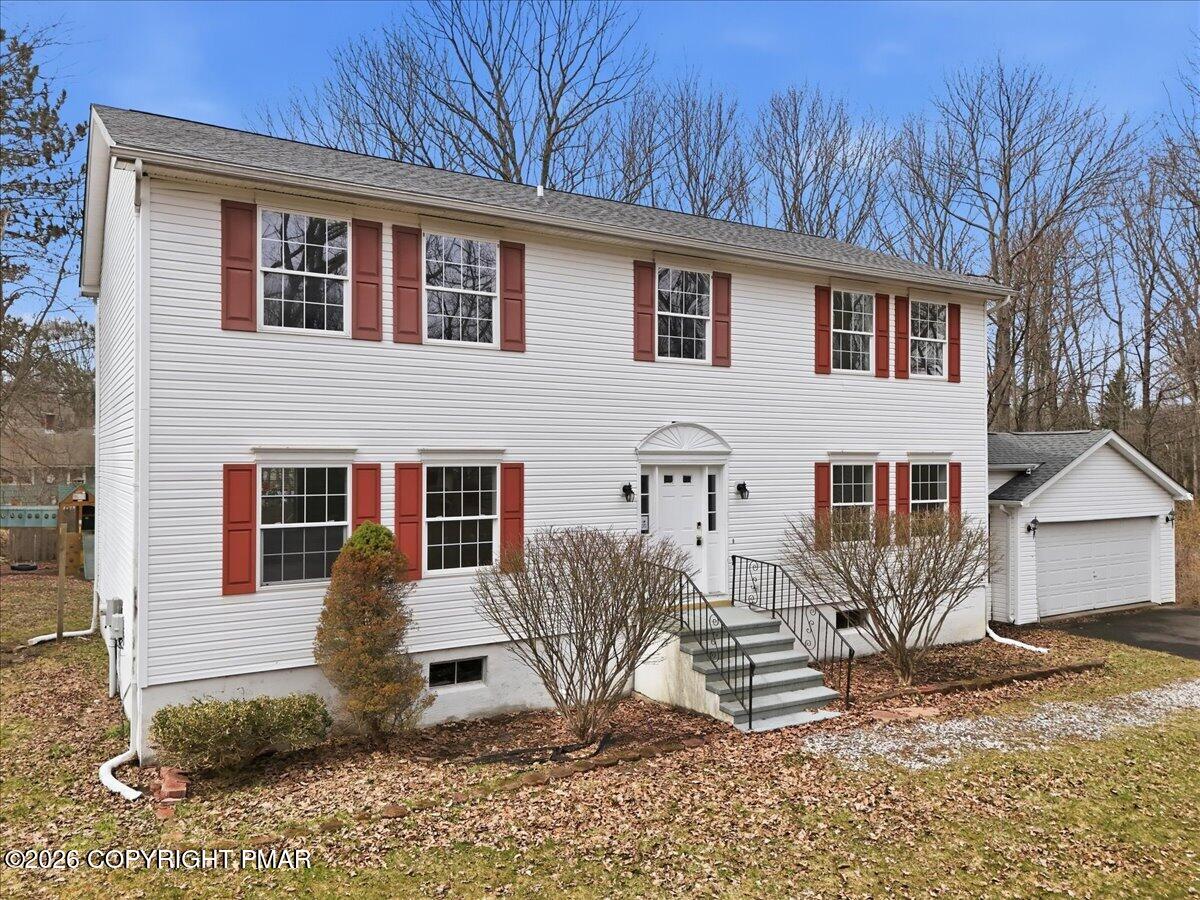 12 Devonshire Lane Mount Pocono, PA 18344 - Photo 3 of 39 a view of a house with a yard and sitting area