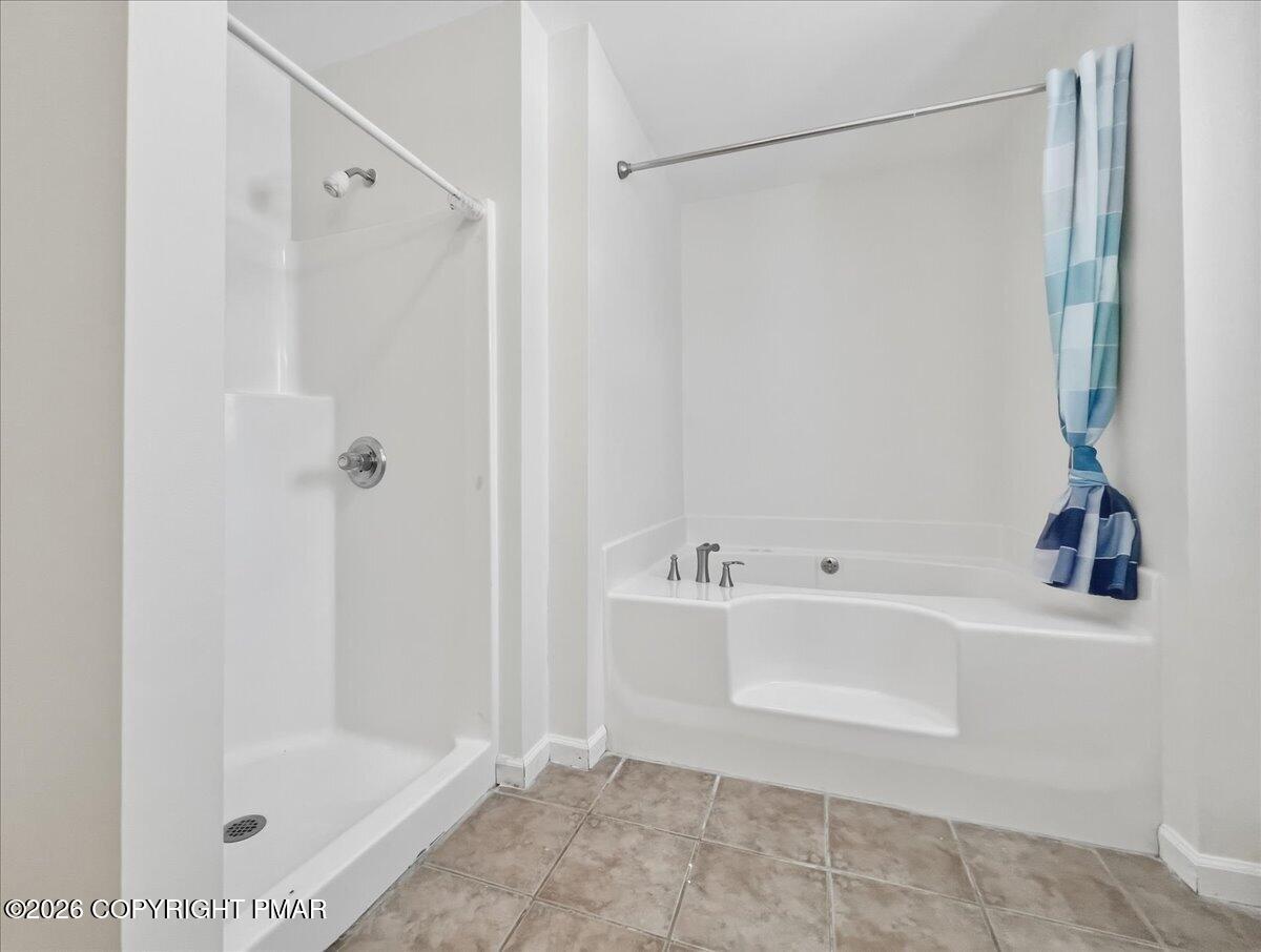 12 Devonshire Lane Mount Pocono, PA 18344 - Photo 32 of 39 a bathroom with a bathtub and a shower