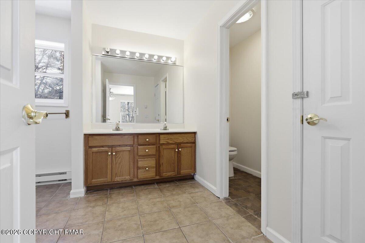 12 Devonshire Lane Mount Pocono, PA 18344 - Photo 34 of 39 a spacious bathroom with a granite countertop sink a mirror and a