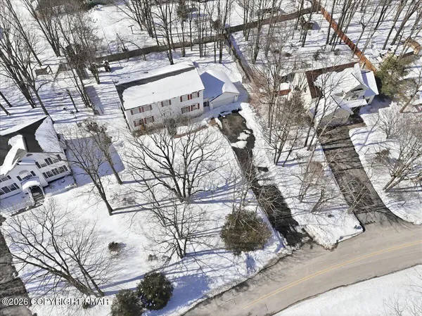 a picture of street view with a barn