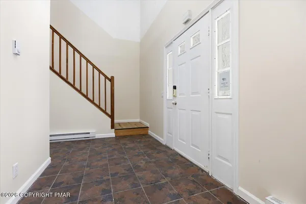 a view of an entryway with staircase