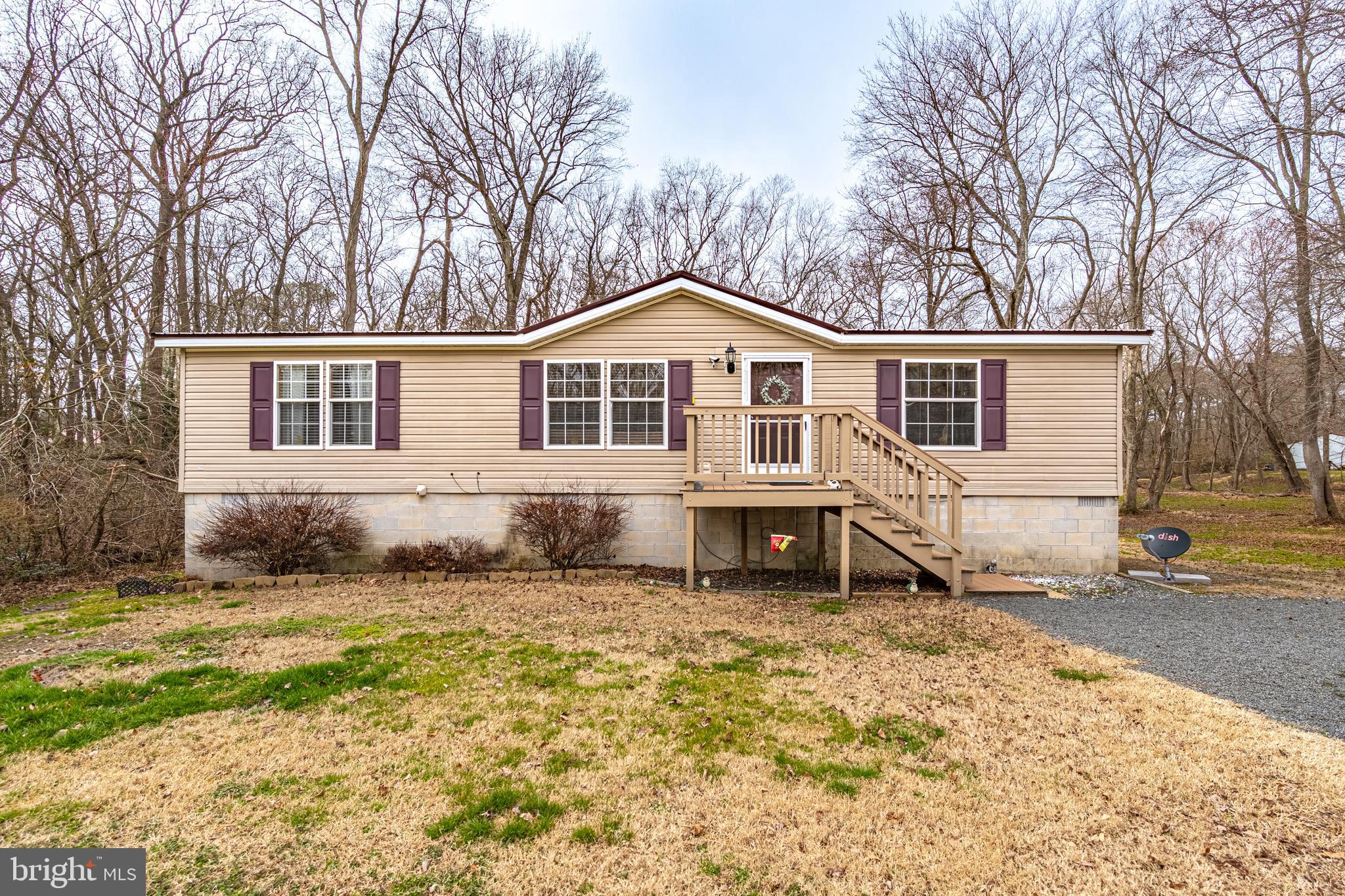 13301 Old Stage Road Bishopville, MD 21813 - Photo 1 of 43 a white house that has a tree in front of it