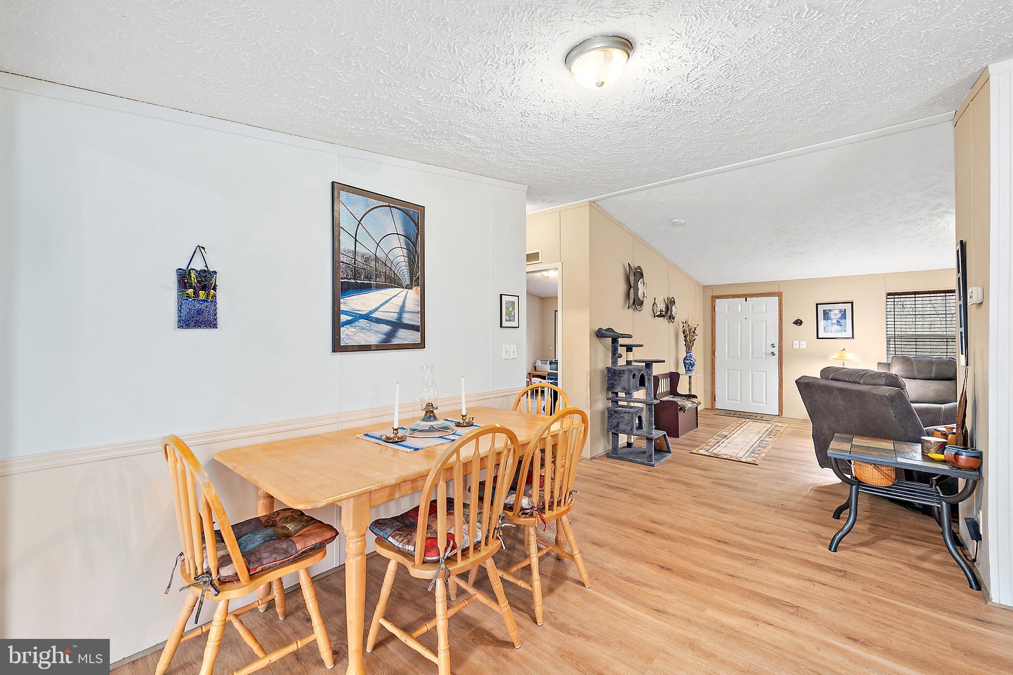 13301 Old Stage Road Bishopville, MD 21813 - Photo 11 of 43 a dining room with furniture and wooden floor