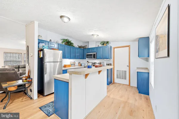 a kitchen with stainless steel appliances granite countertop a stove and a sink