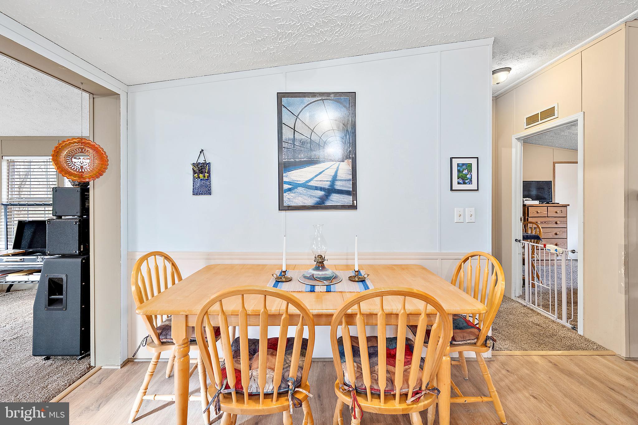 13301 Old Stage Road Bishopville, MD 21813 - Photo 18 of 43 a dining room with furniture and wooden floor