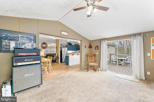 a bedroom with a bed rug and a large window