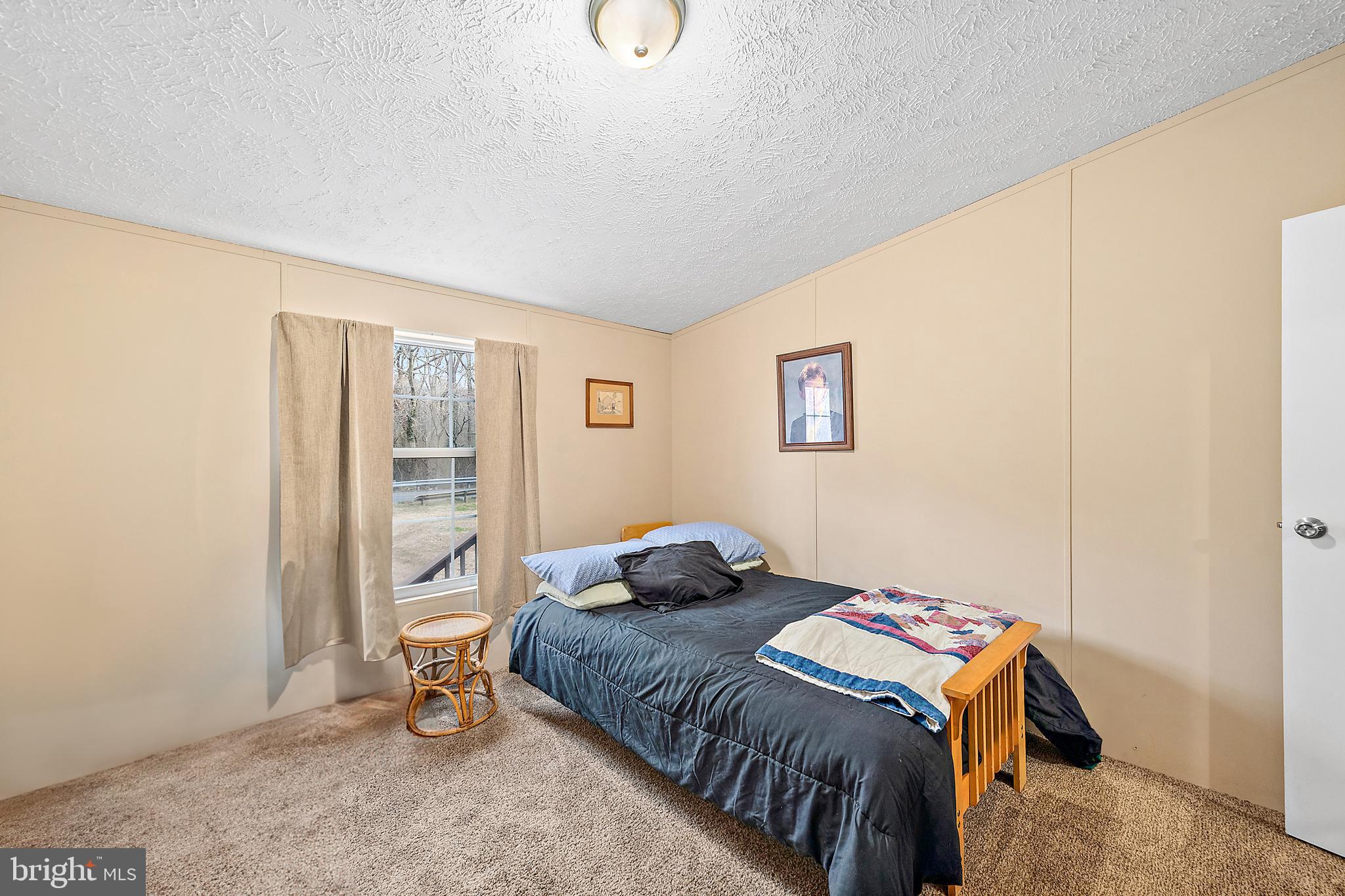 13301 Old Stage Road Bishopville, MD 21813 - Photo 30 of 43 a bedroom with a bed and wooden floor