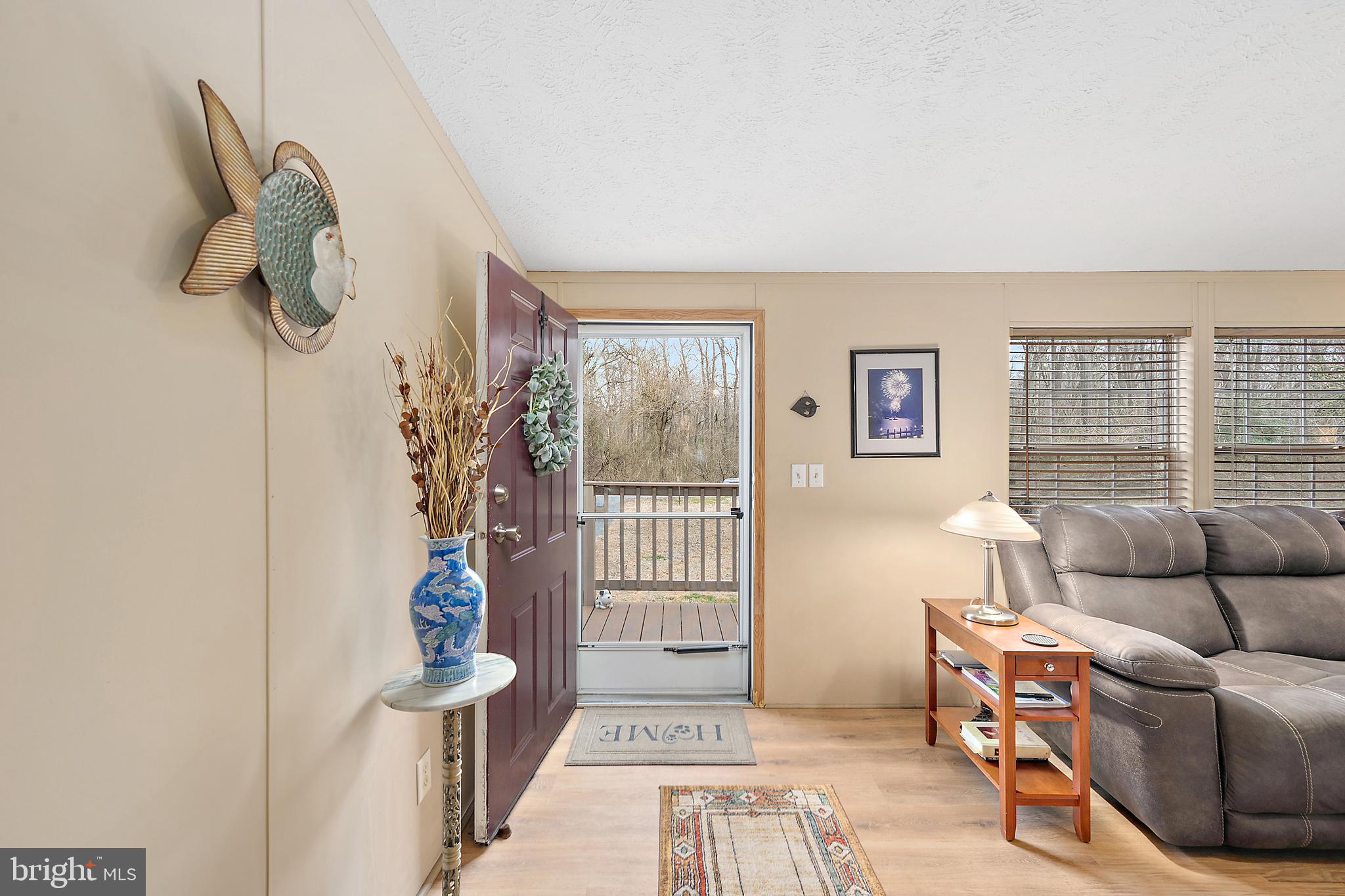 13301 Old Stage Road Bishopville, MD 21813 - Photo 3 of 43 a living room with furniture and a window