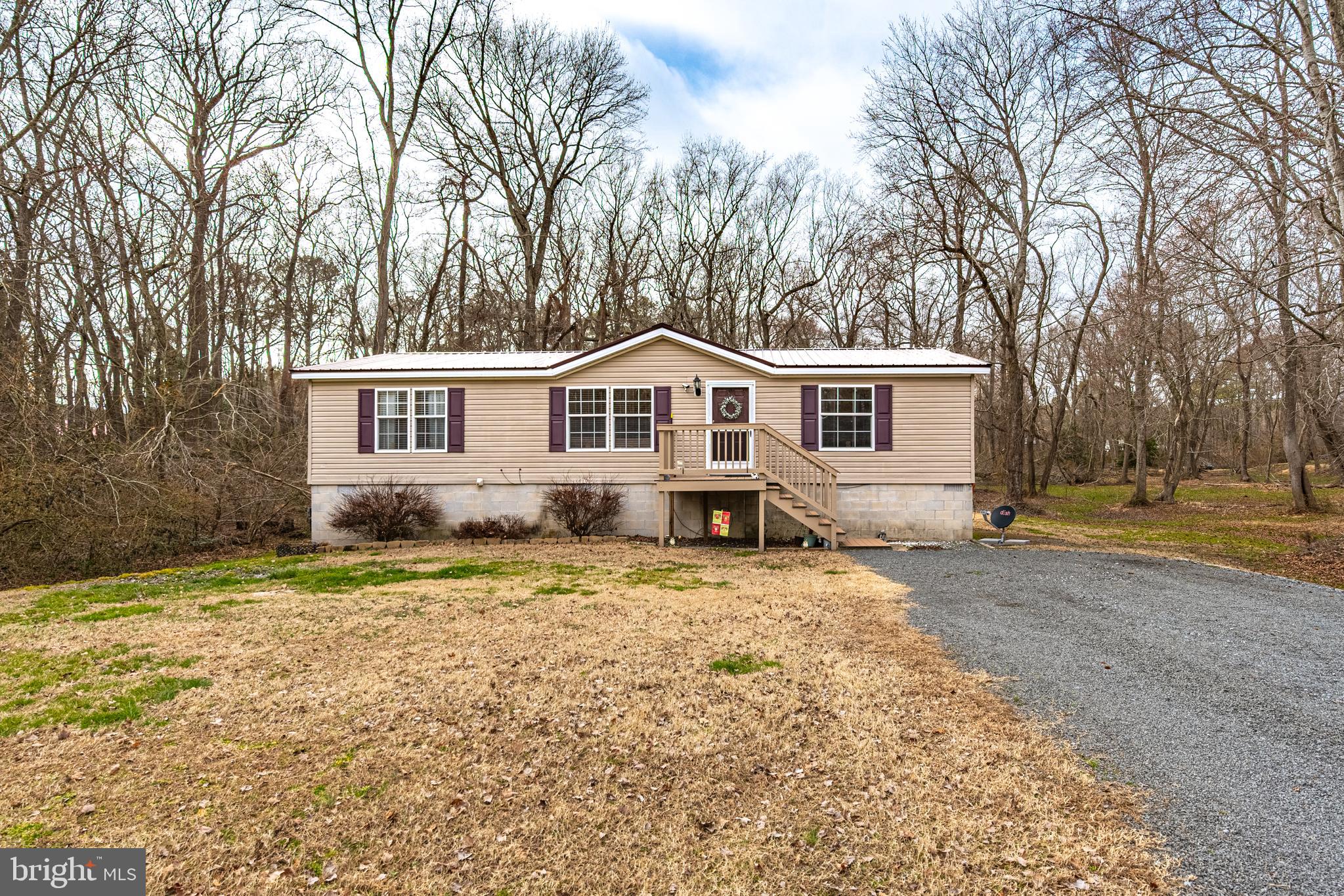 13301 Old Stage Road Bishopville, MD 21813 - Photo 40 of 43 a front view of a house with a yard