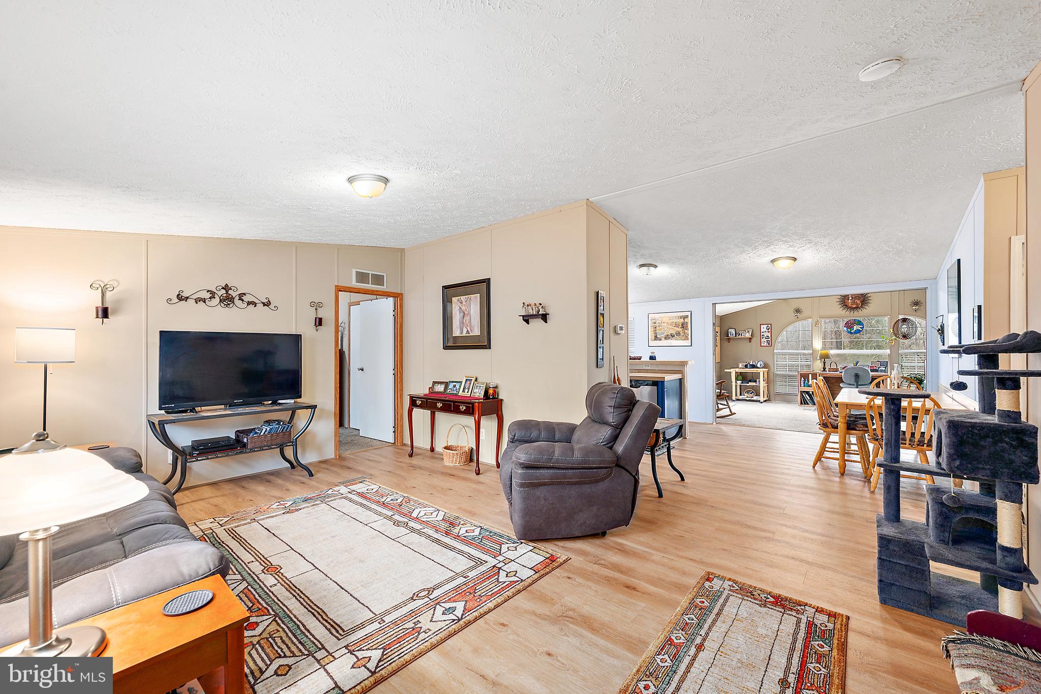 13301 Old Stage Road Bishopville, MD 21813 - Photo 4 of 43 a living room with furniture and a flat screen tv