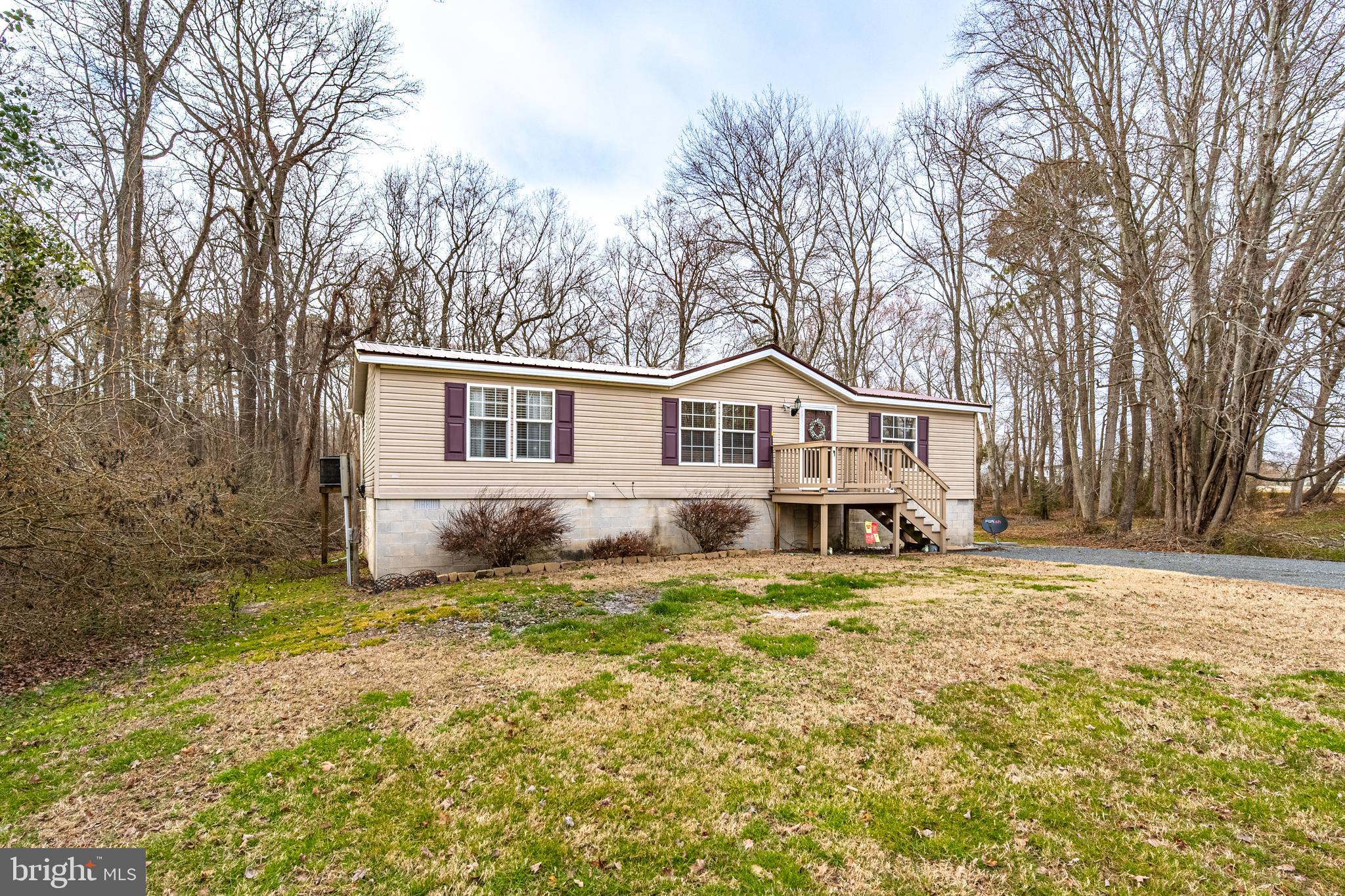 13301 Old Stage Road Bishopville, MD 21813 - Photo 41 of 43 a front view of a house with a yard