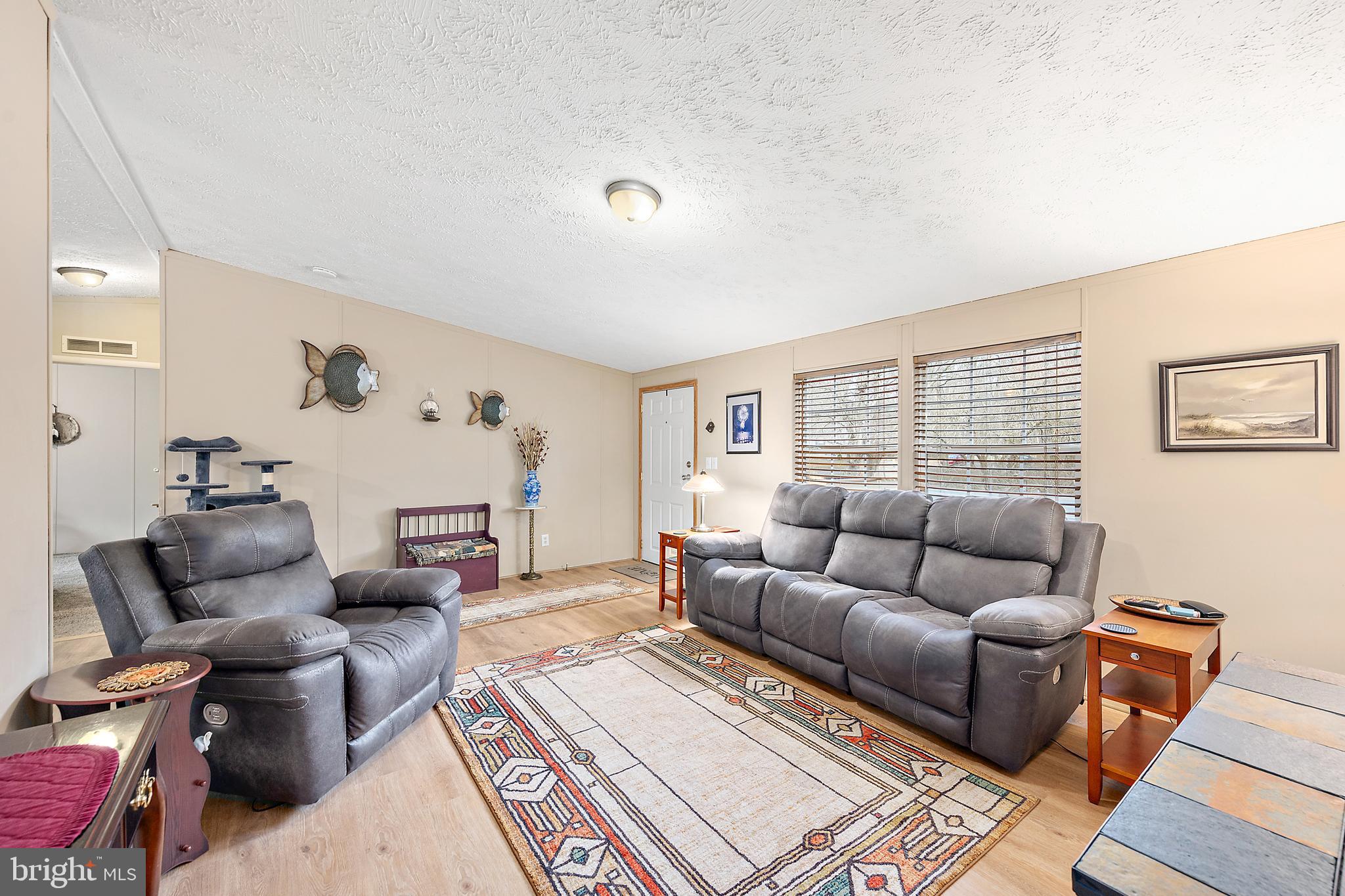 13301 Old Stage Road Bishopville, MD 21813 - Photo 7 of 43 a living room with furniture and a large window