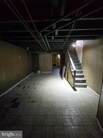 a view of wooden floor with stairs