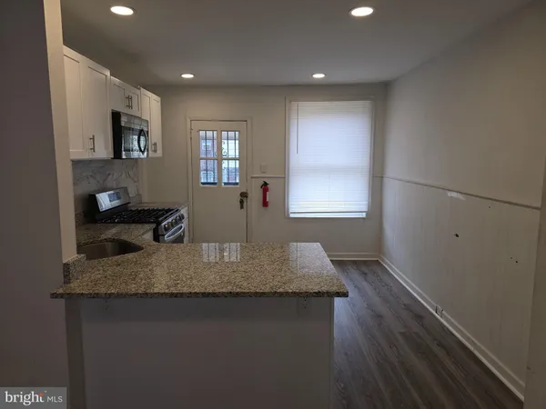 a kitchen with sink and window