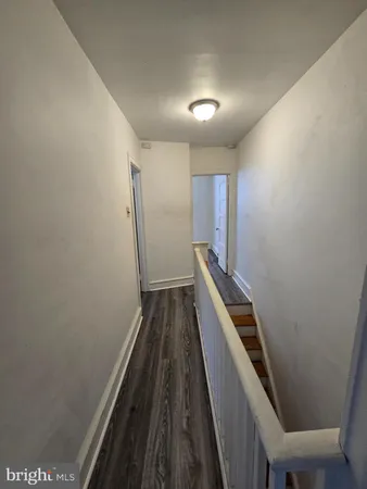 a view of a hall with wooden floor